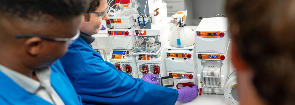 Syrris' Leandro Carvalho in the lab demonstrating the Asia microreactor