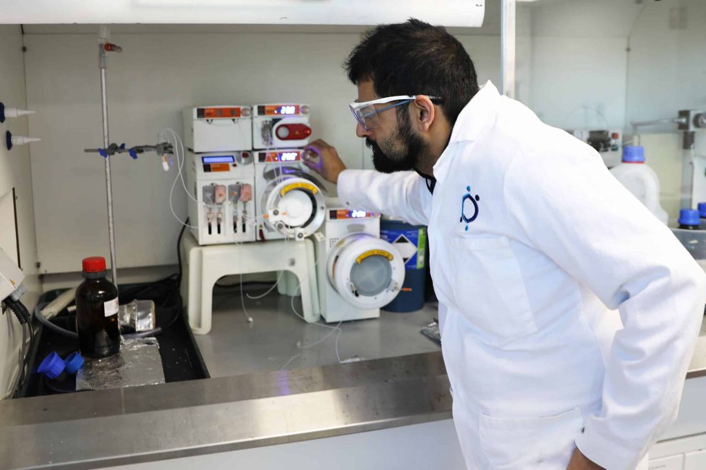 Dr. Raminder Mulla shown with Sygnature Discovery’s Asia Flow Chemistry System.