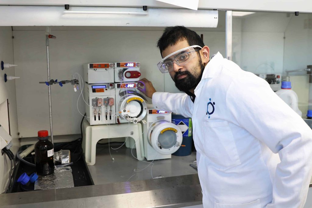 Dr. Raminder Mulla shown with Sygnature Discovery’s Asia Flow Chemistry System.